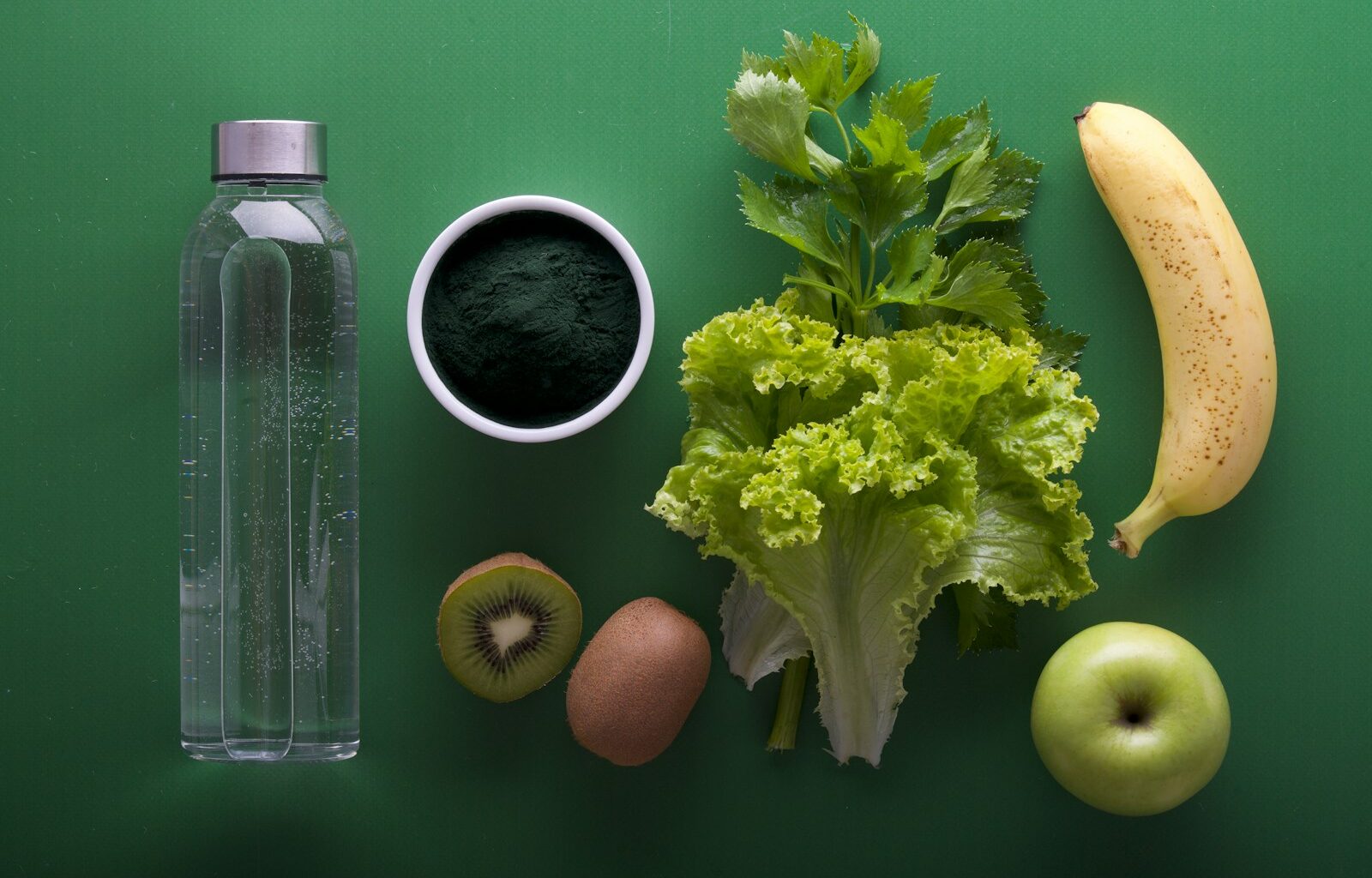 assorted fruits and vegetables on green surface
